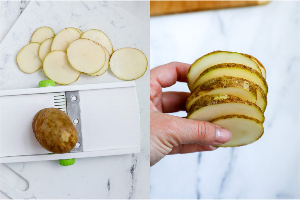 Hand holding a stack of potato slices, next to a mandolin with slices. 