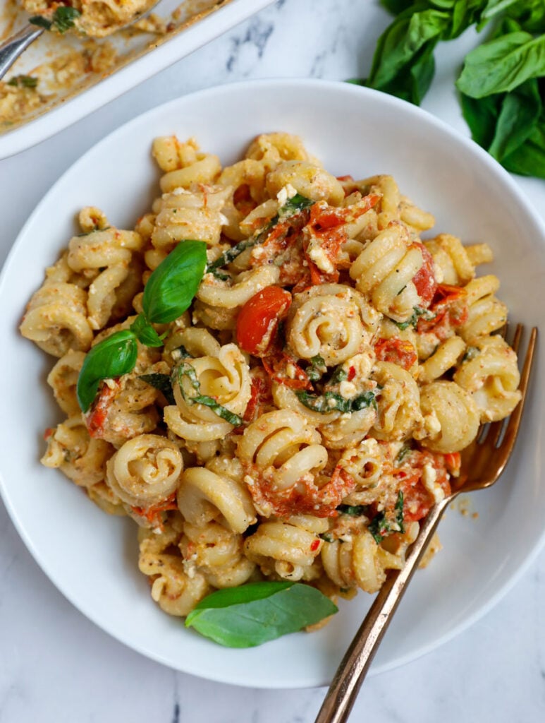 Overhead photo of a baked feta pasta in a bowl.