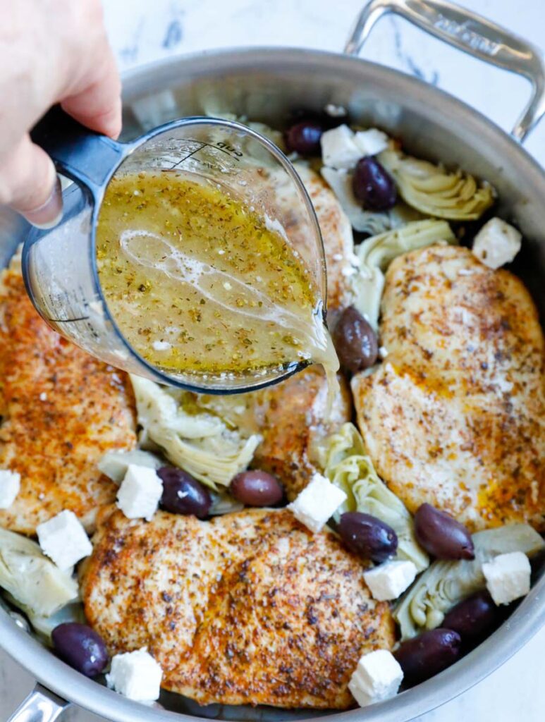 Pouring marinade onto chicken in a pot