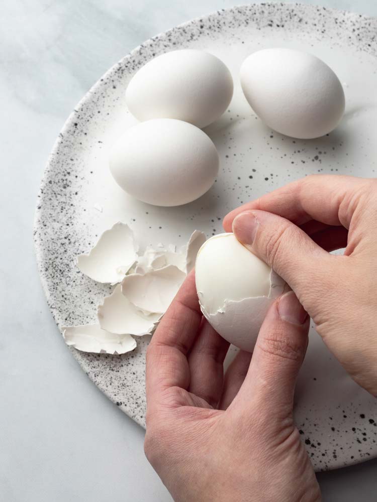 an egg being peeled