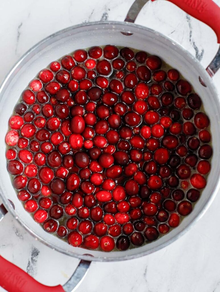 cranberries added to the pot of orange juice