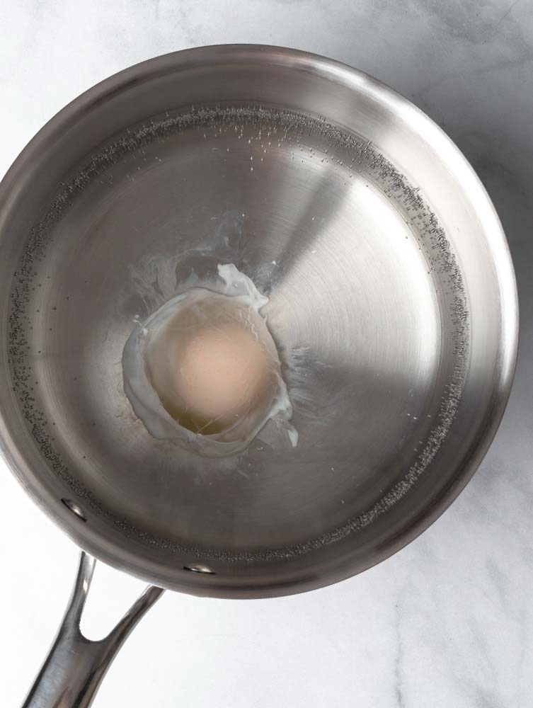 egg in a pot of hot water