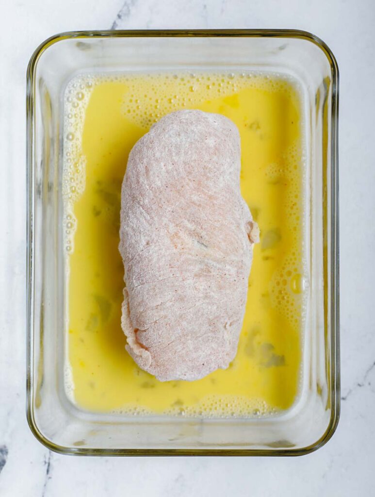 Stuffed chicken in egg wash.