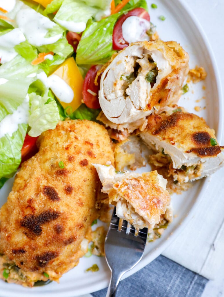 Top down view of jalapeno popper chicken and a fork.