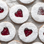 Overhead image of multiple assembled strawberry cookies.