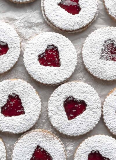 Overhead image of multiple assembled strawberry cookies.