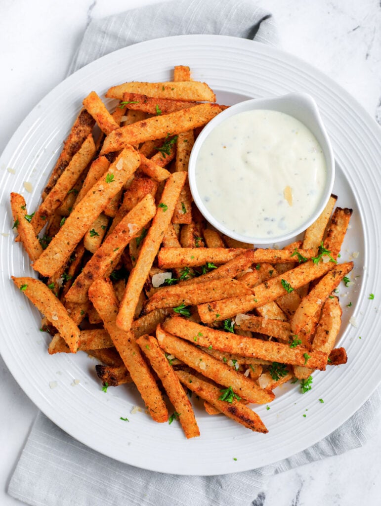 White plate with Jicama Fries and dip.