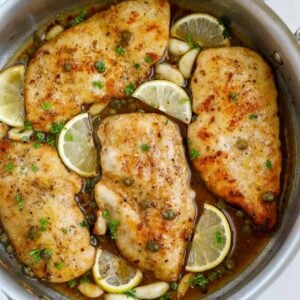 Top down view of lemon chicken piccata in a pot.