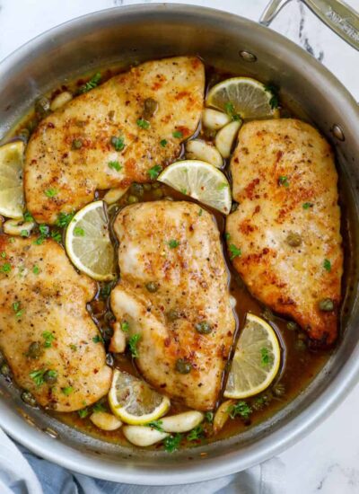 Top down view of lemon chicken piccata in a pot.