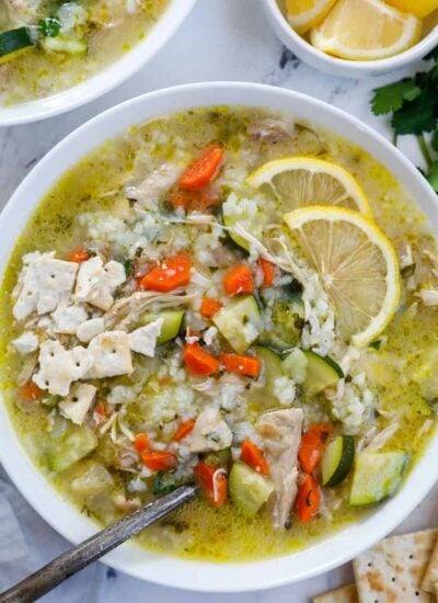 Overhead view of a bowl of lemon chicken rice soup.