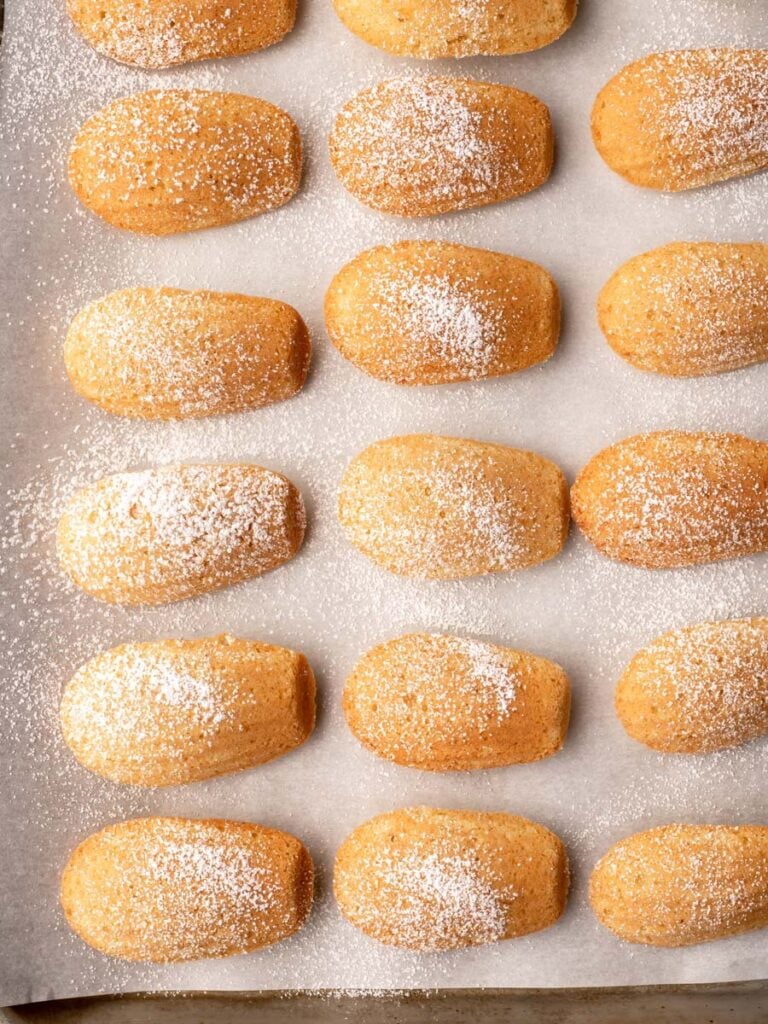 Madeleines on a sheet pan.