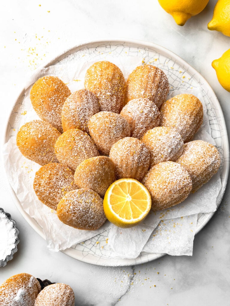 A white plate of lemon madeleines.