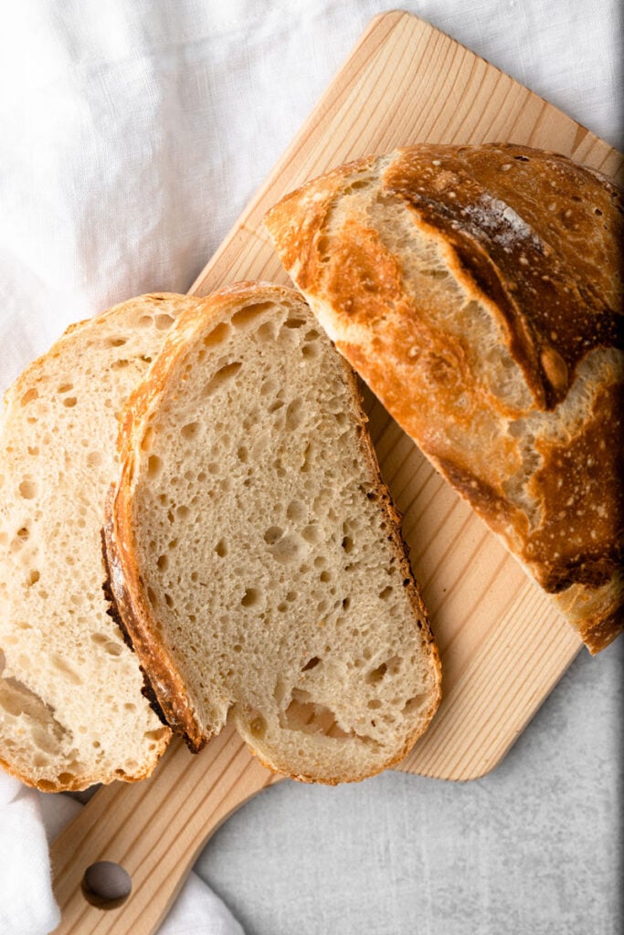 No knead artisan bread sliced opened.