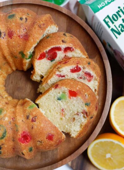 fruit cake cut up and served on a wooden plate