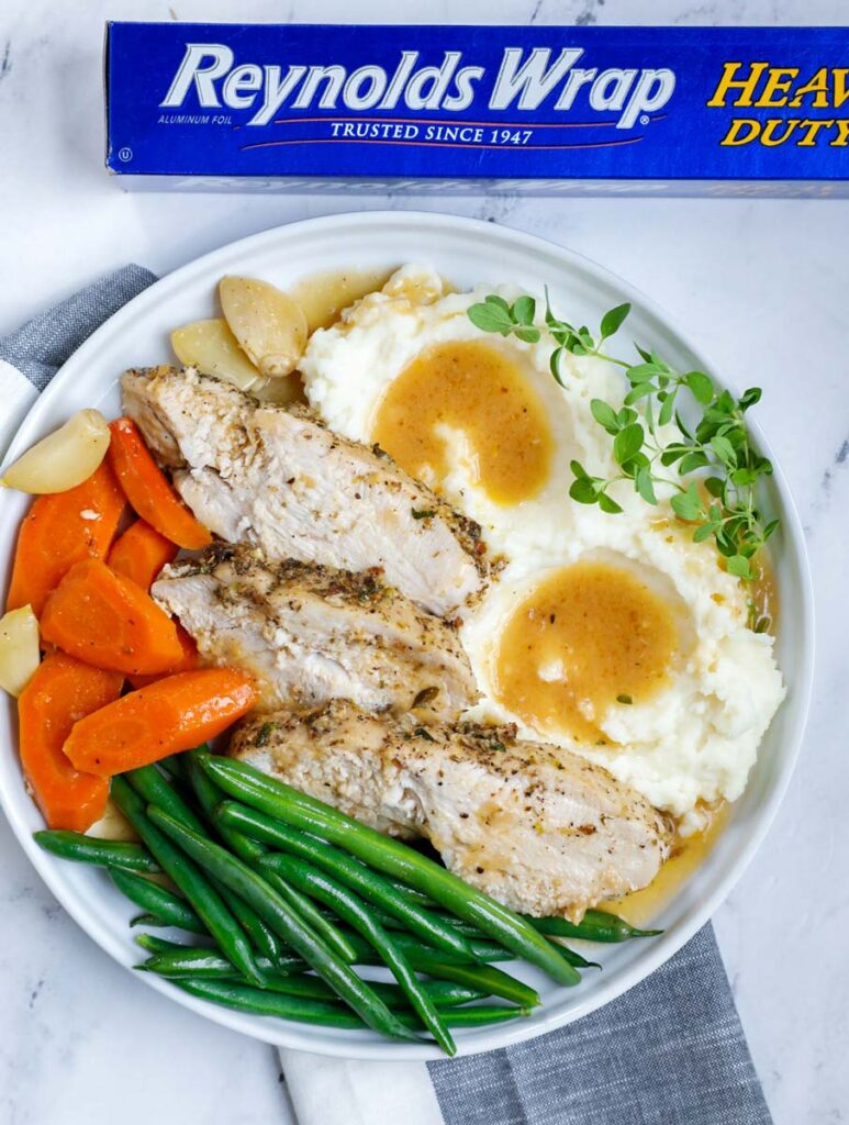 plate of turkey breast with vegetables and mashed potatoes