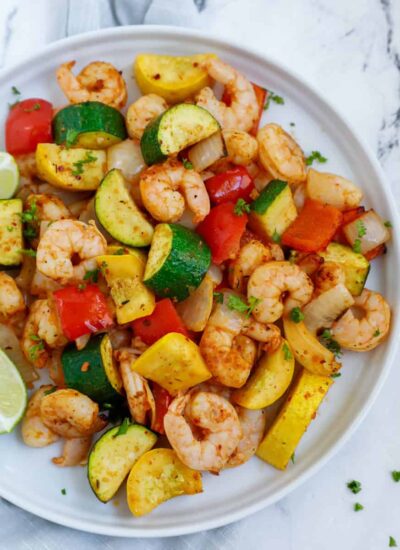 overhead shot of the shrimp and vegetables in a white plate