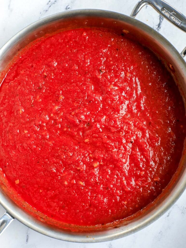 Top down shot of tomato sauce in a pot.