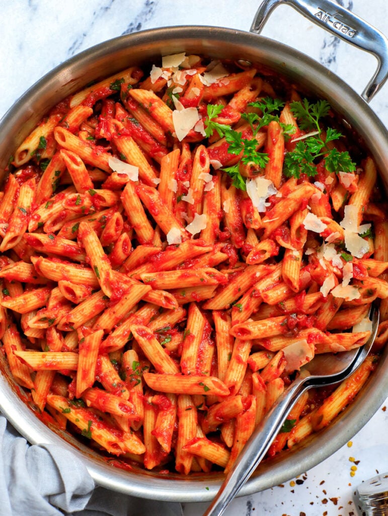 Top down shot of spicy arrabbiata pasta in a pot.