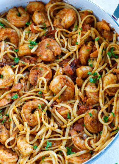 Overhead shot of spicy shrimp pasta in a skillet.