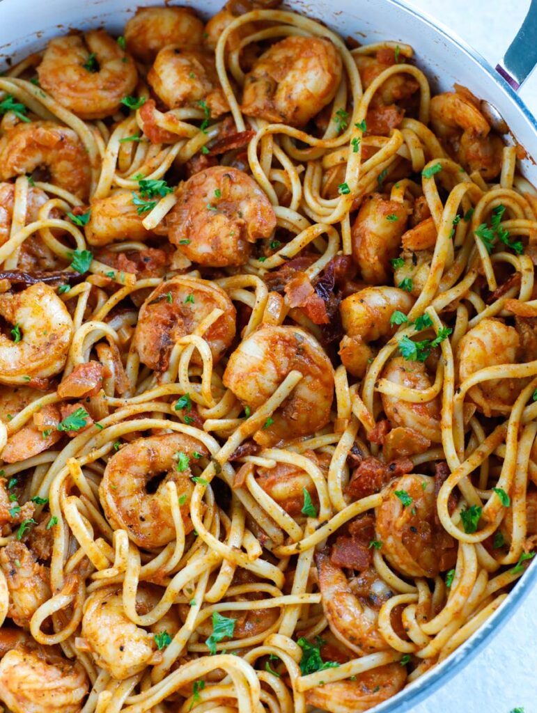 Overhead shot of spicy shrimp pasta in a skillet.