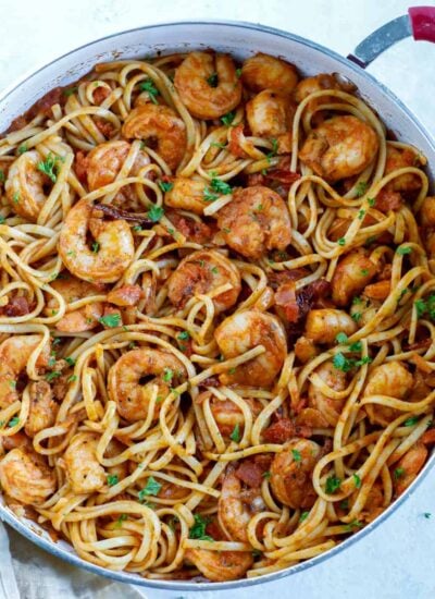 Overhead shot of spicy shrimp pasta in a skillet.