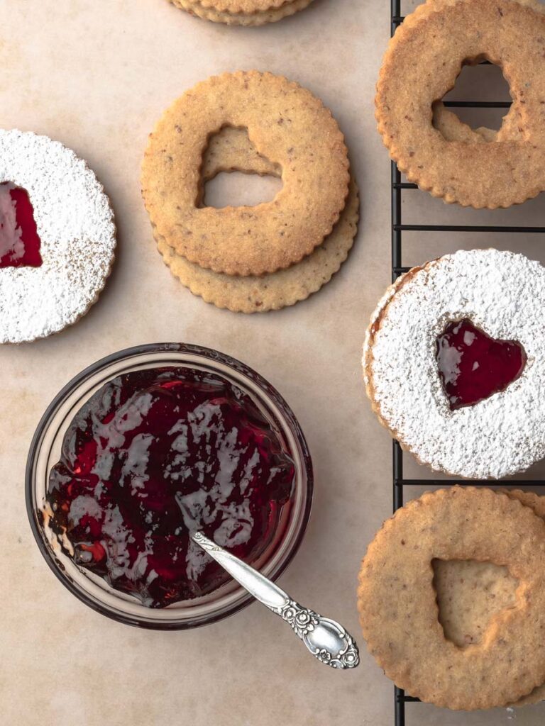 Overhead image of assembling the strawberry jelly linzer cookies.