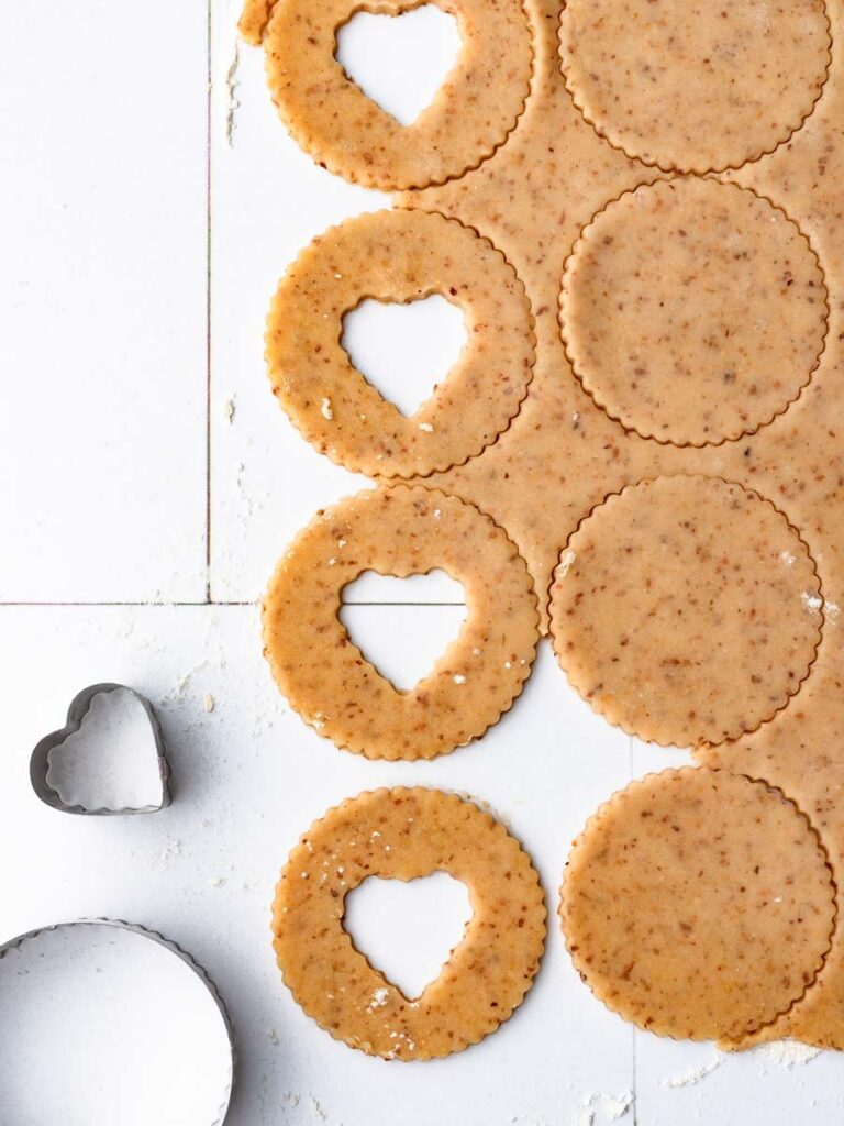 Cutting out dough with a cookie cutter.