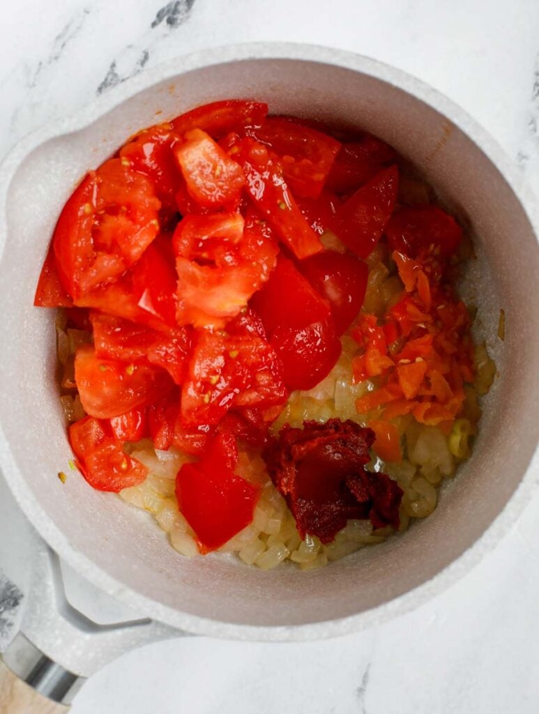 Top down shot of mixing sauce ingredients in a bowl.