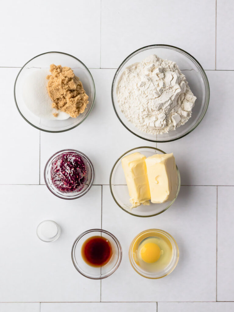 Top down view of ingredients for jam thumbprint cookies.