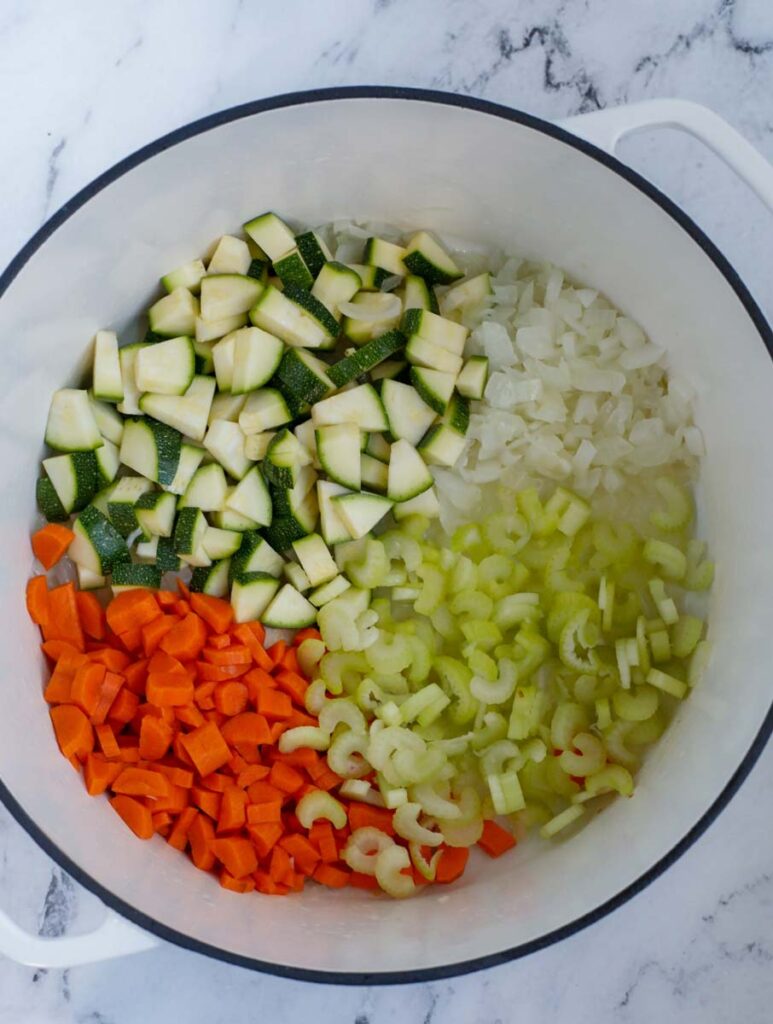 Top down shot of diced vegetables in a bowl.