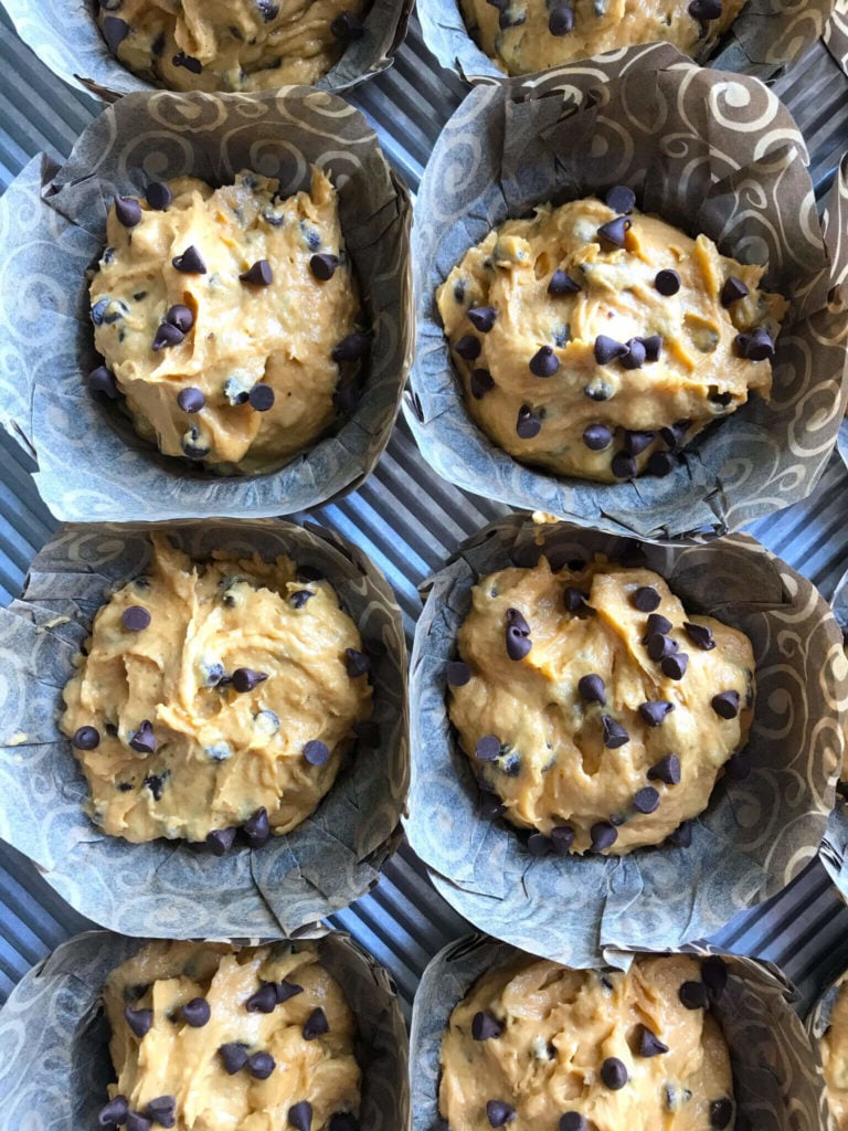 raw muffin batter in a muffin tin