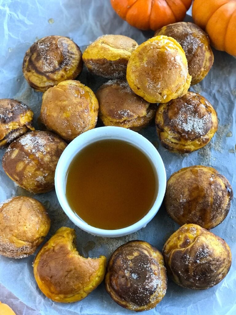 Pumpkin Pancake Bites with a bowl of syrup