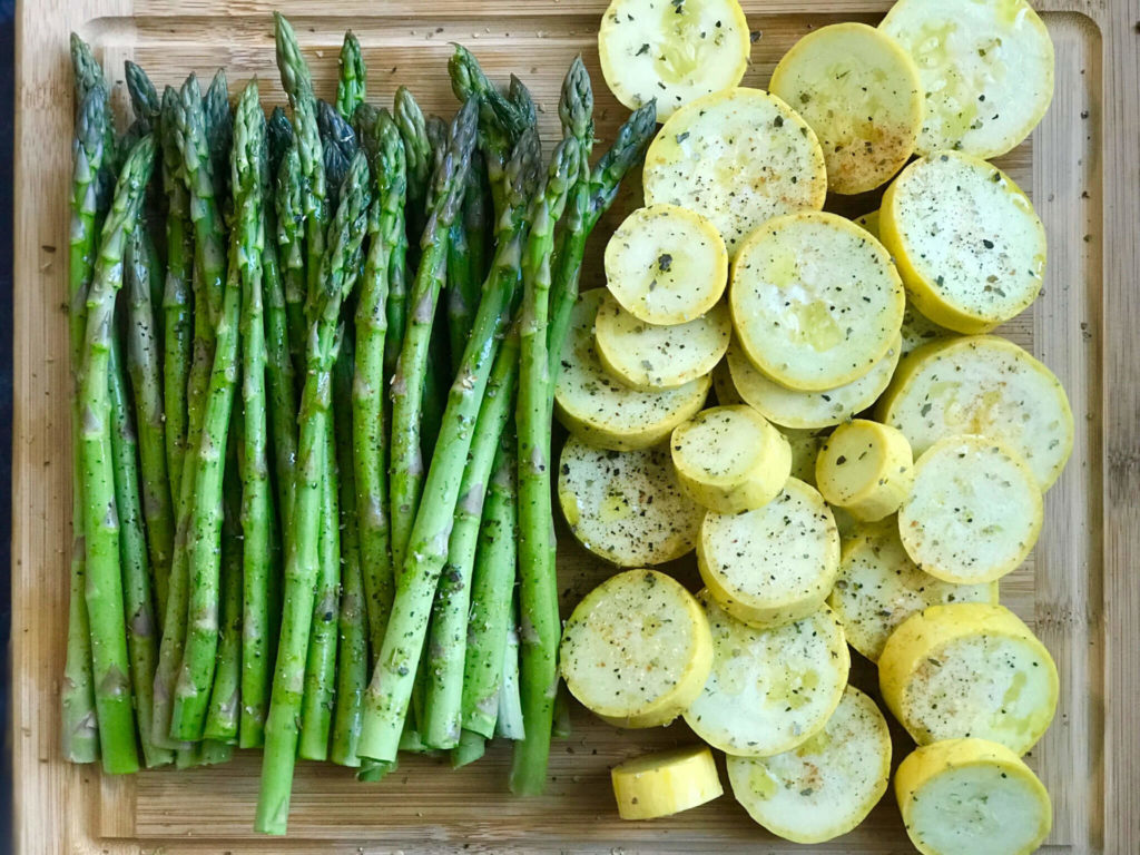 Asparagus and squash with spices sprinkled on them