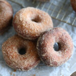 batch of donuts on parchment.