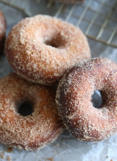 batch of donuts on parchment.