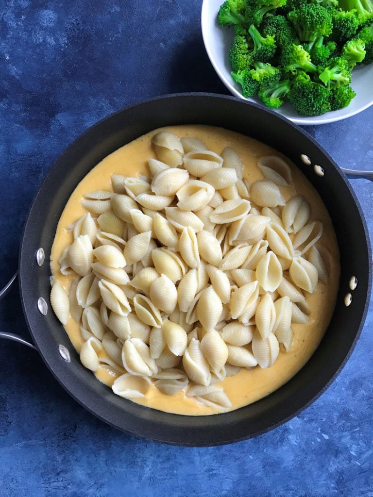 Pasta and cheese sauce in a skillet.