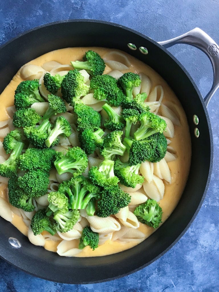 Broccoli and pasta in a skillet.
