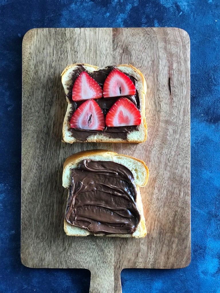 Top down view of nutella spread on bread. 