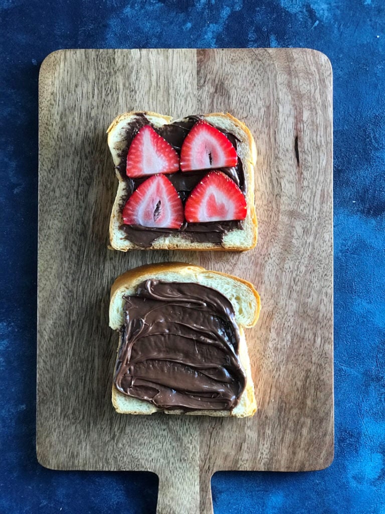Top down view of nutella spread on bread.