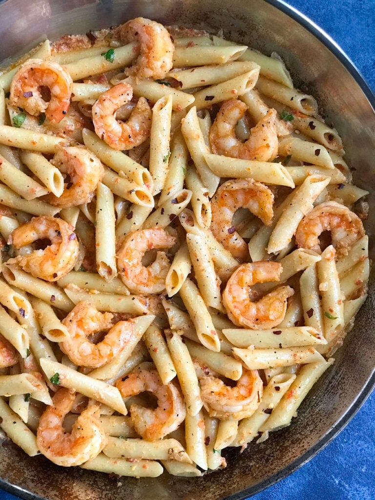 Creamy Shrimp Penne Pasta With Red Pepper Sauce in a skillet