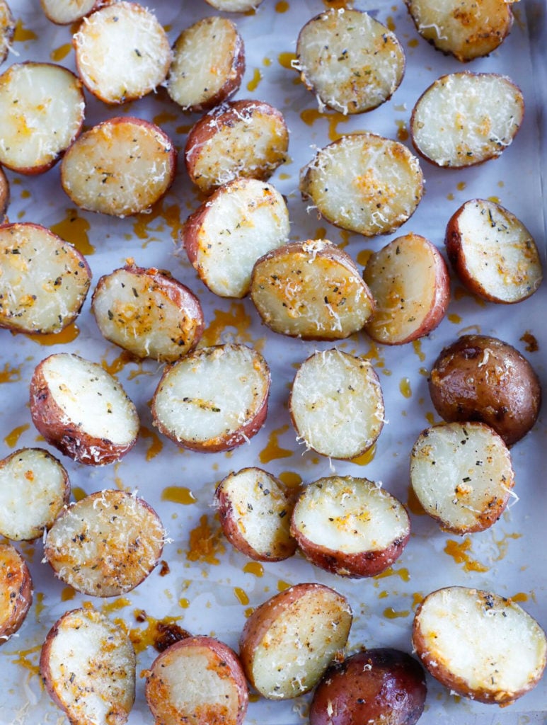 The coated potatoes on a baking sheet