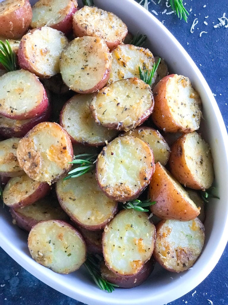 Parmesan roasted potatoes served in a white dish