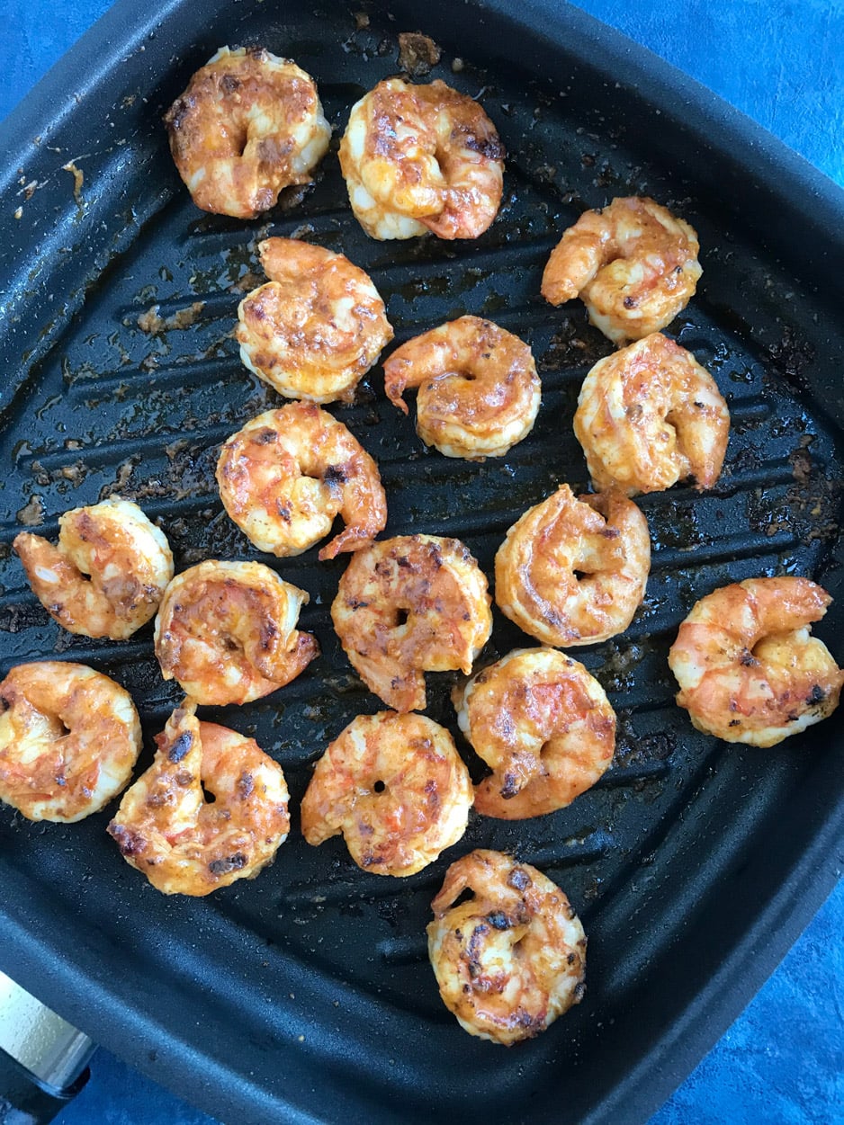 Fiesta Shrimp Taco Bowl 3 Shrimp sizzling in a pan, cooking to perfection