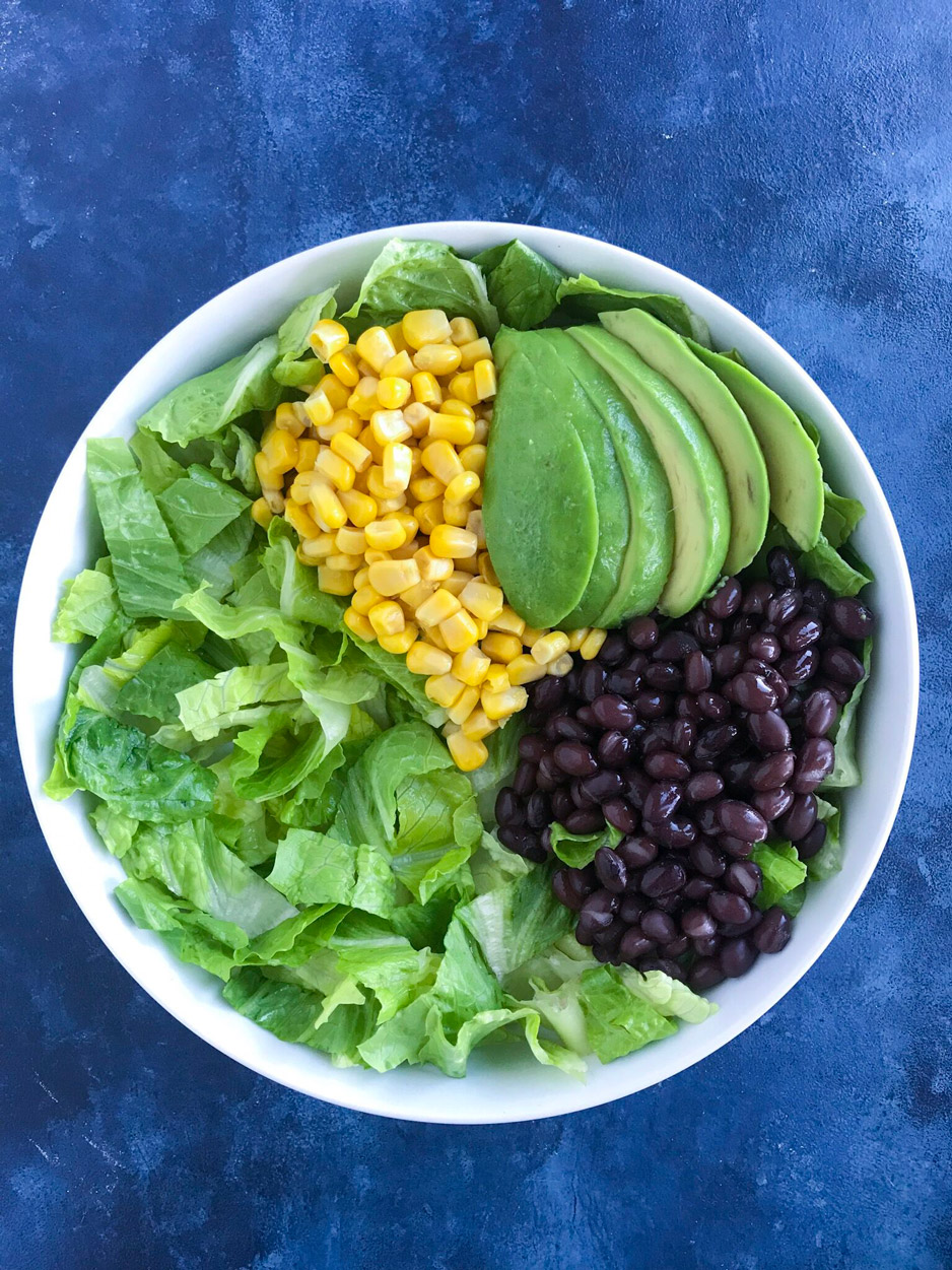 Fiesta Shrimp Taco Bowl 4 The salad base for a shrimp taco bowl recipe before adding shrimp