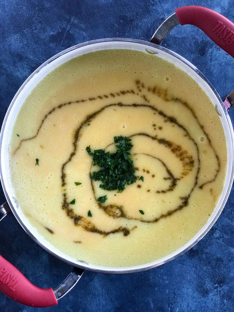Lebanese Lentil Soup blended in a pot with the spices and herbs added