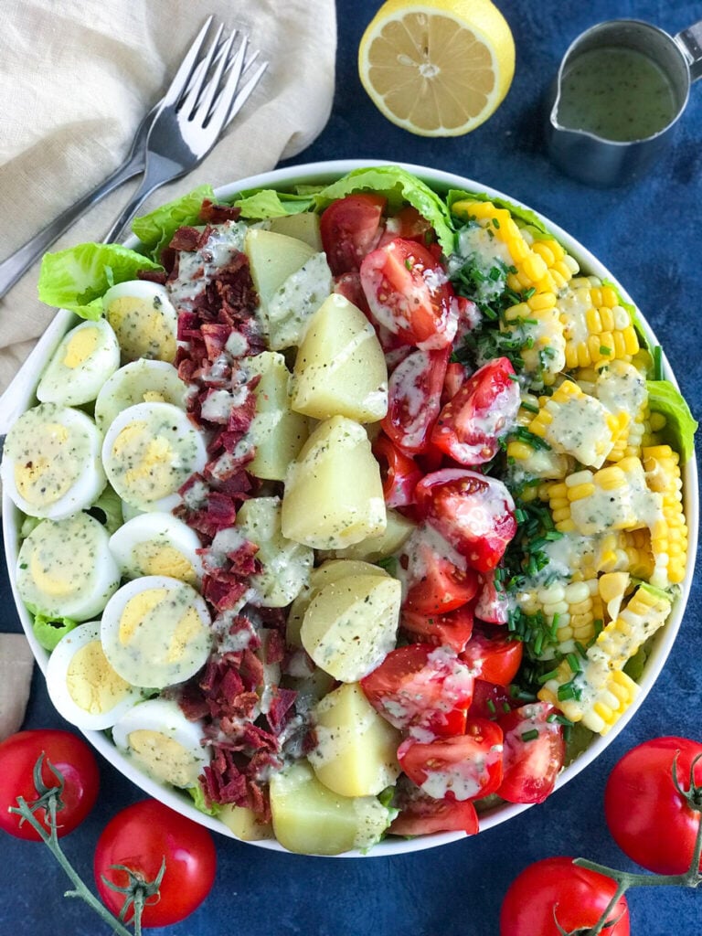 Potato Cobb Salad served in a large white bowl