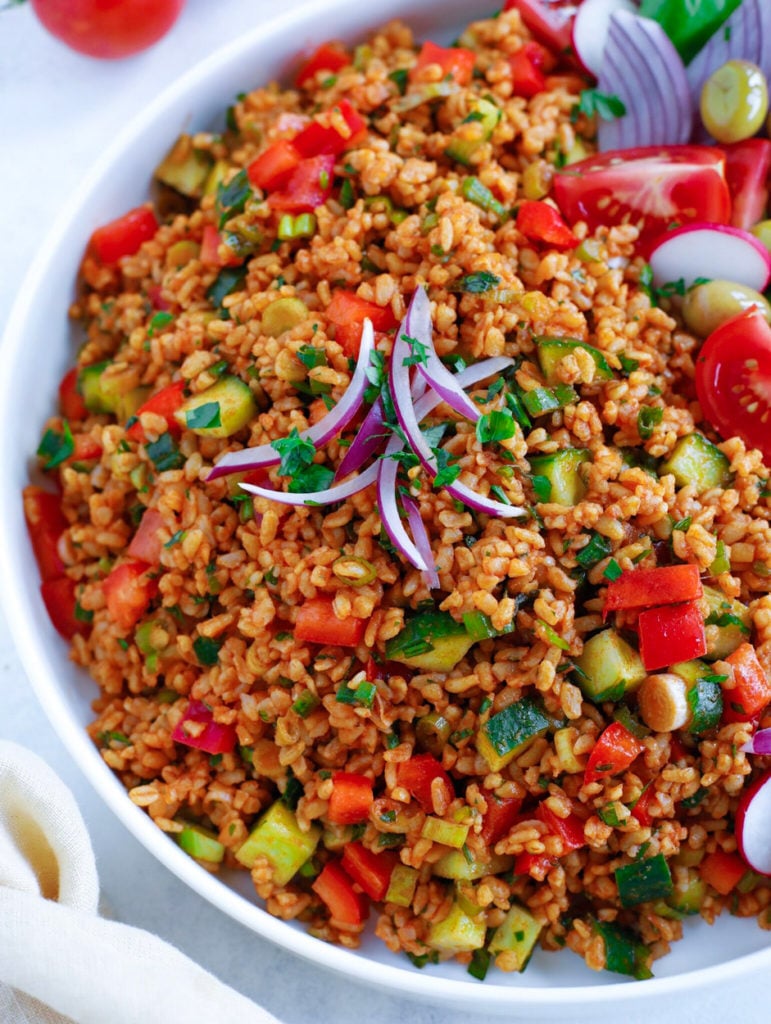 Turkish Bulgur Salad( Kisir) topped with sliced red onion