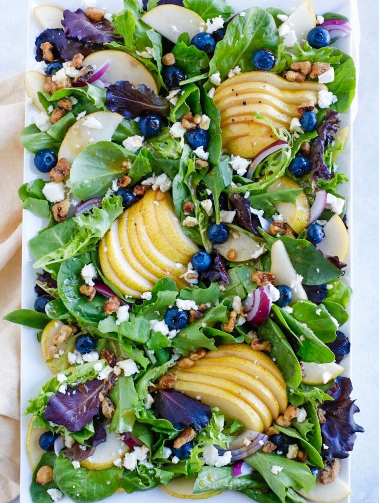 Autumn Pear Salad overhead shot of fall salad on a square white plate