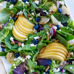 fall salad on a white plate.