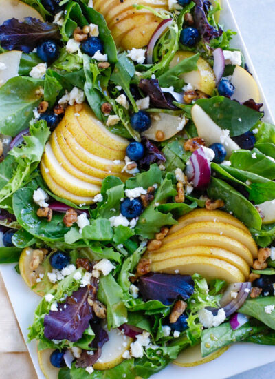 fall salad on a white plate.